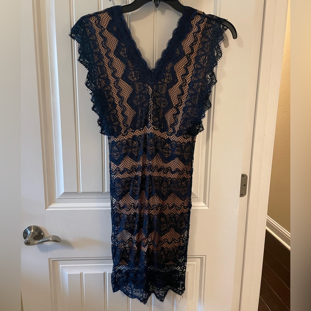 Lace, hip-hugging dress size S.